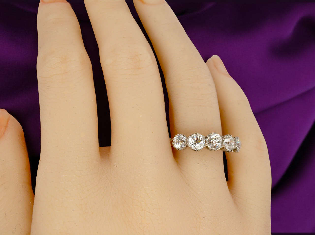 hand An impressive early 20th-century ring set with five old brilliant-cut white diamonds.
