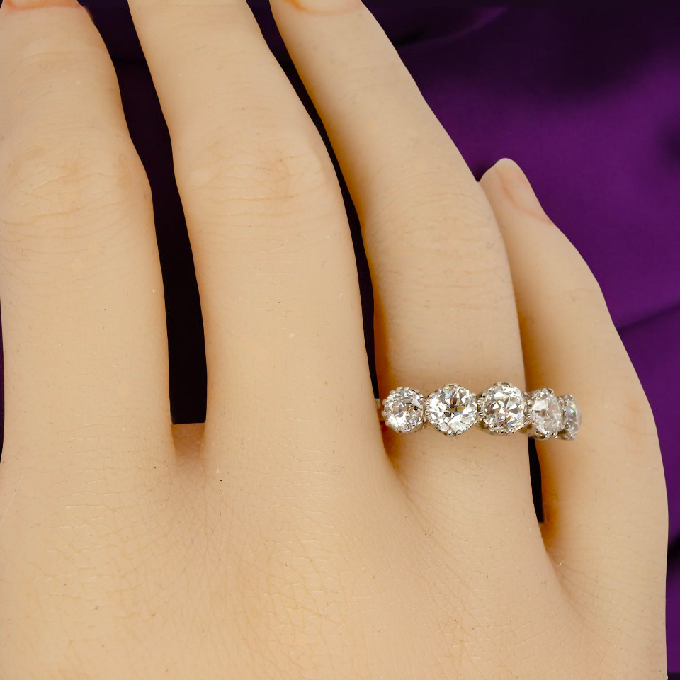 hand An impressive early 20th-century ring set with five old brilliant-cut white diamonds.