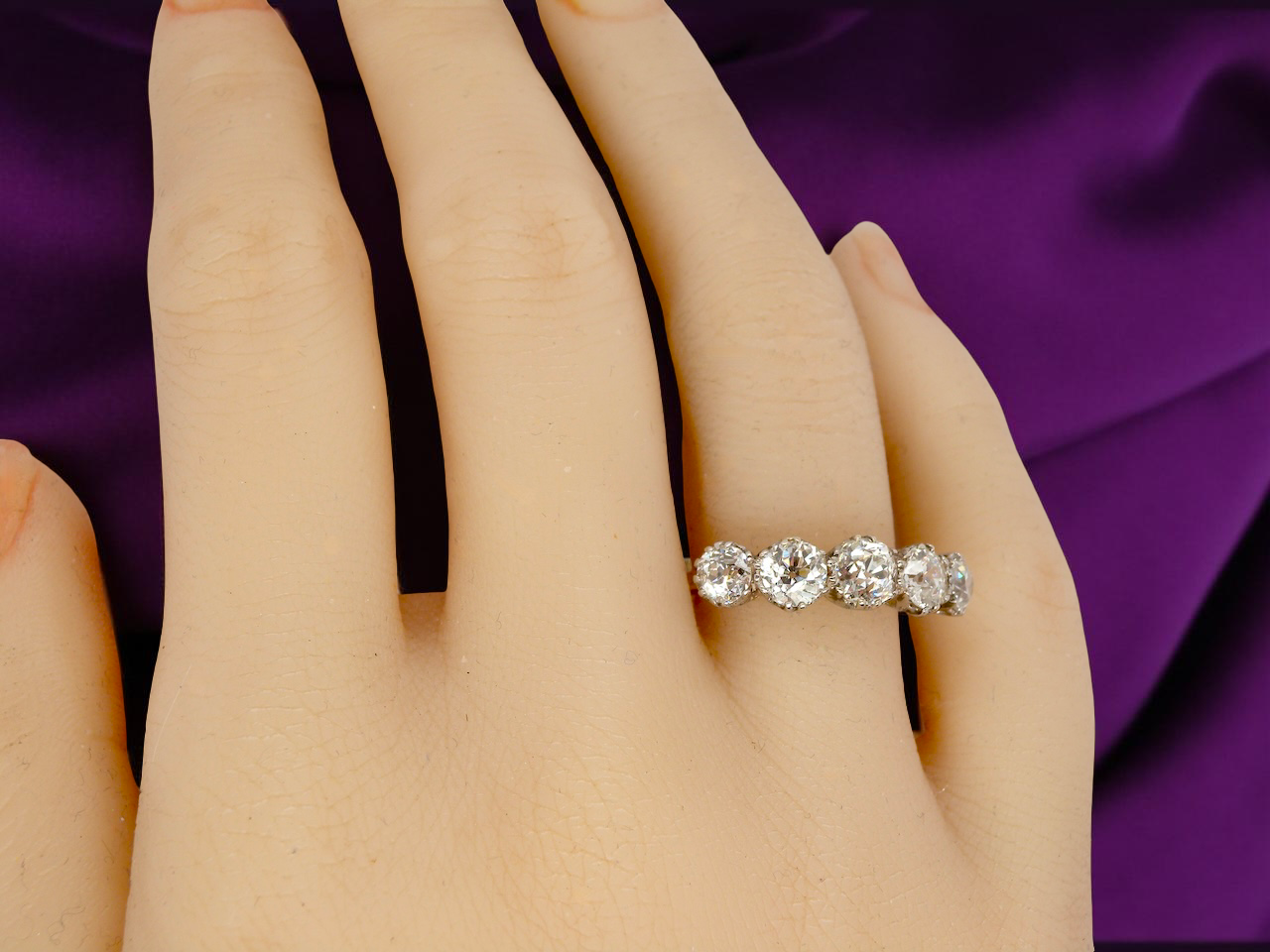 hand An impressive early 20th-century ring set with five old brilliant-cut white diamonds.