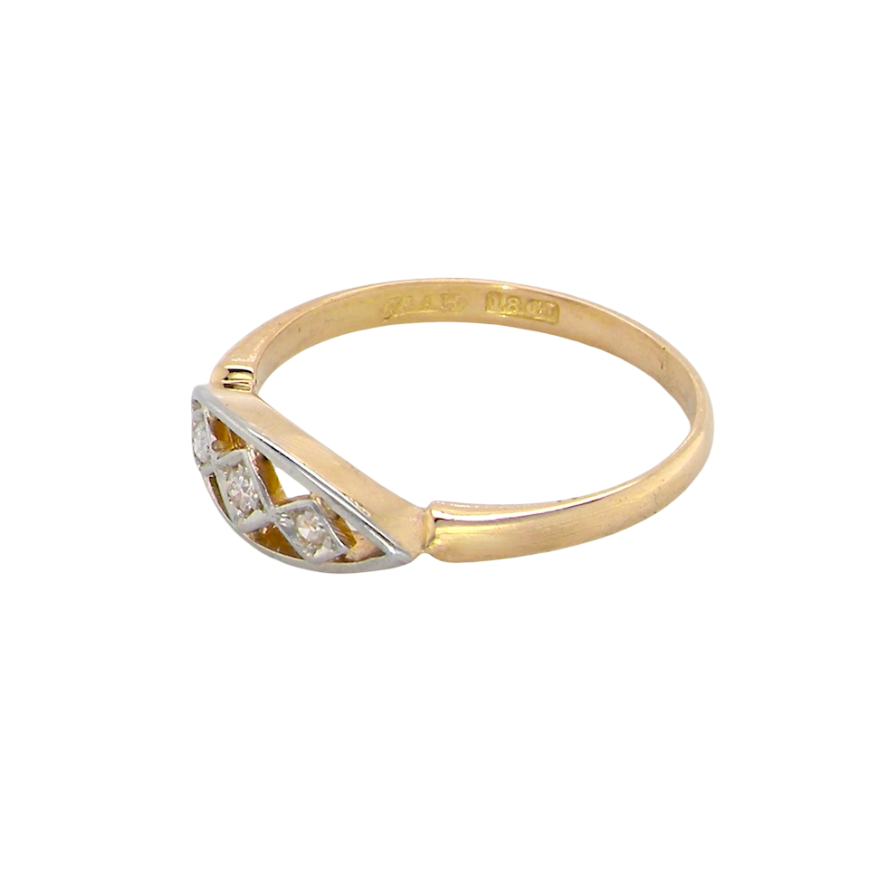 Two-tone gold ring with diamond on a white background
