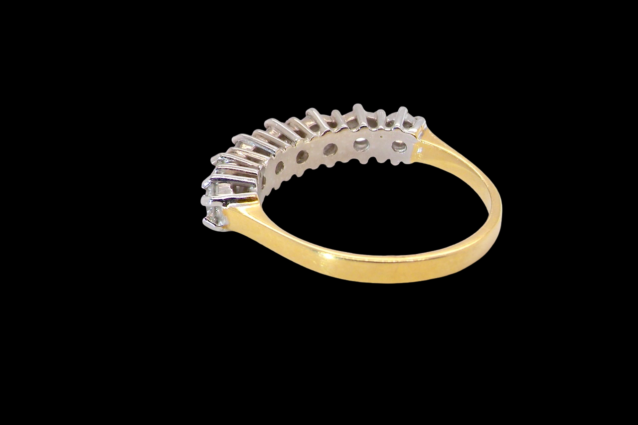 A Seven-Stone Half Hoop Diamond Ring