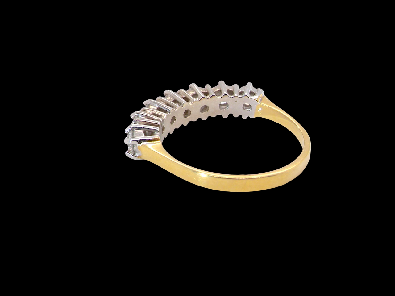 A Seven-Stone Half Hoop Diamond Ring