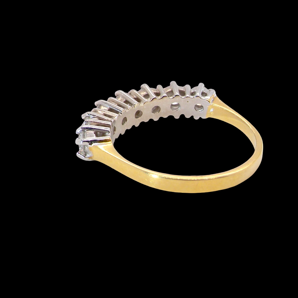 A Seven-Stone Half Hoop Diamond Ring