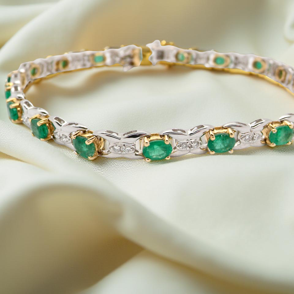 A white gold Emerald and Diamond bracelet