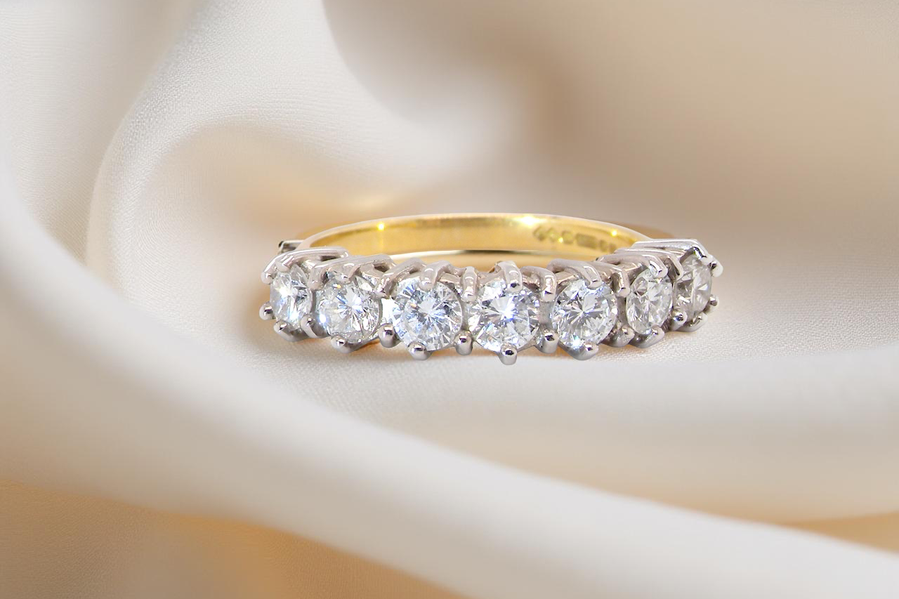 A Seven-Stone Half Hoop Diamond Ring