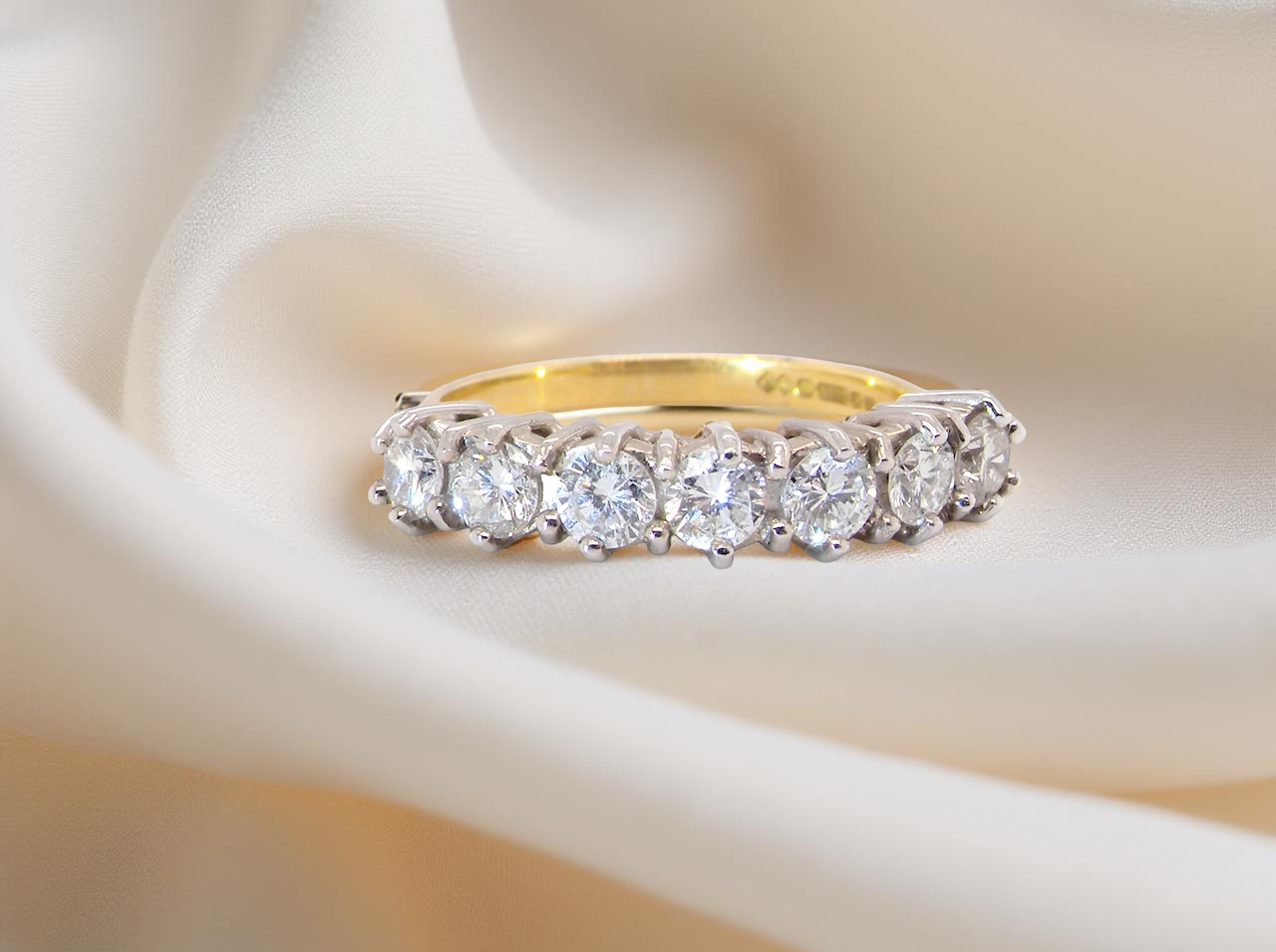 A Seven-Stone Half Hoop Diamond Ring