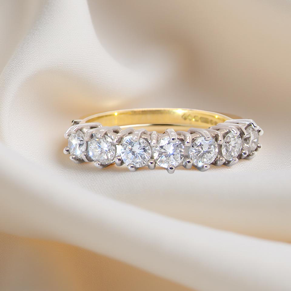 A Seven-Stone Half Hoop Diamond Ring