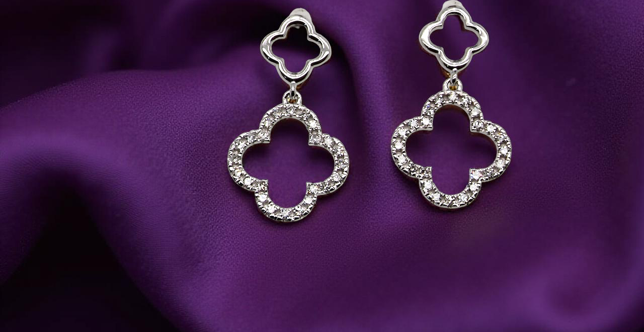 Each earring is set with brilliant cut white diamonds, to a total of 0.51 carats. new