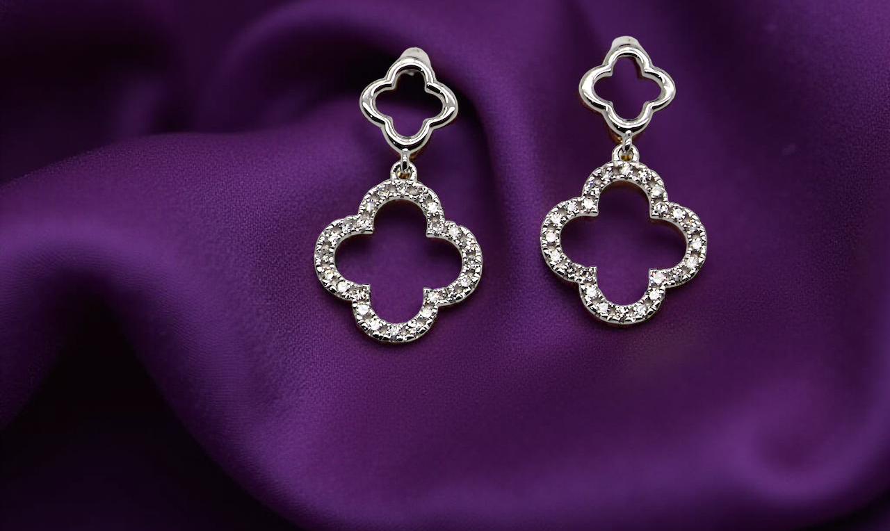Each earring is set with brilliant cut white diamonds, to a total of 0.51 carats. new