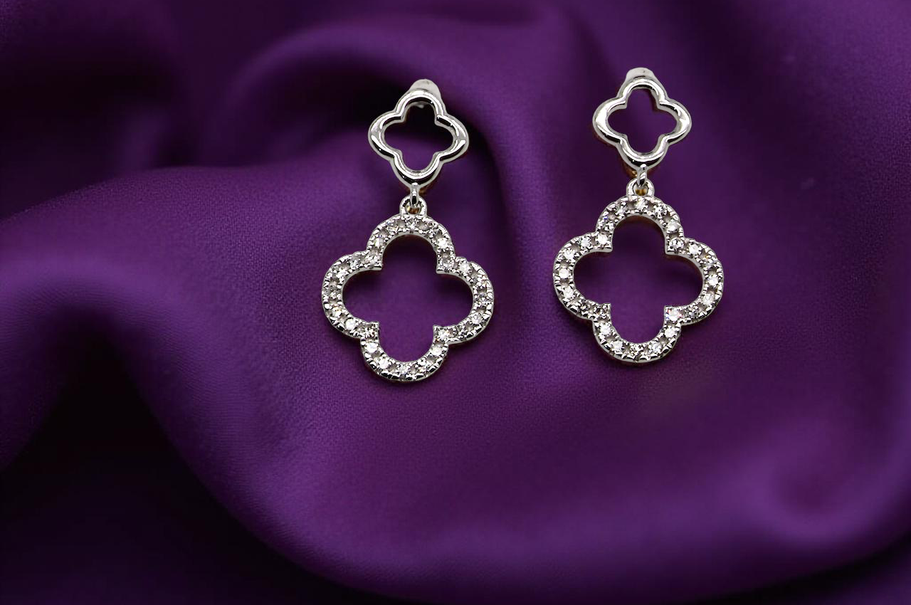Each earring is set with brilliant cut white diamonds, to a total of 0.51 carats. new