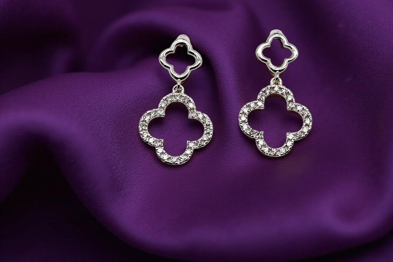 Each earring is set with brilliant cut white diamonds, to a total of 0.51 carats. new