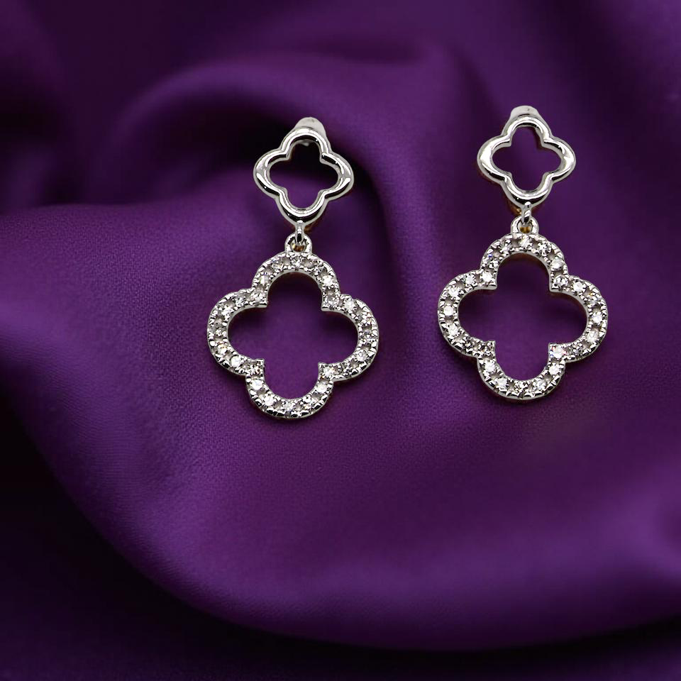 Each earring is set with brilliant cut white diamonds, to a total of 0.51 carats. new