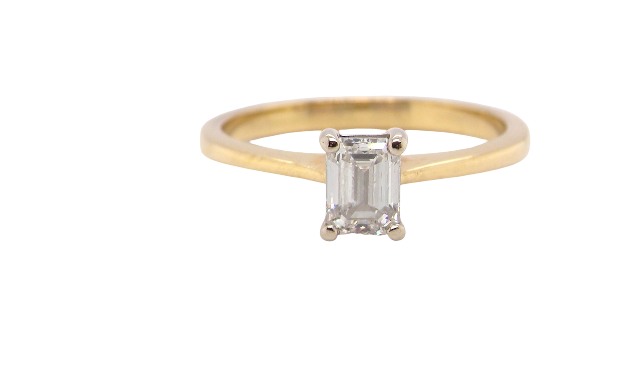 Elegant and timeless, this solitaire ring features a beautifully cut emerald-cut diamond measuring 5 x 4mm, confirmed at approximately 0.40 carats. The diamond is graded J colour and VS clarity, offering excellent sparkle