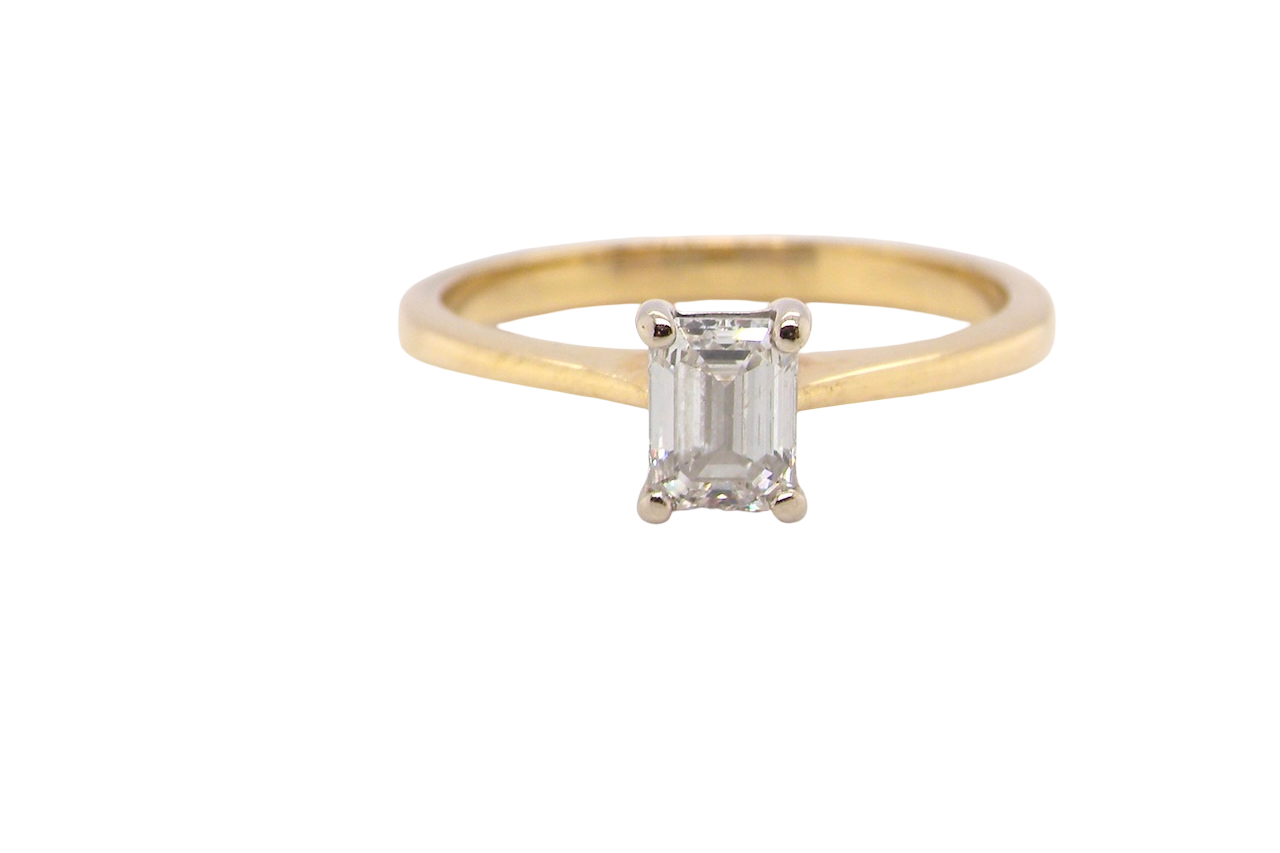 Elegant and timeless, this solitaire ring features a beautifully cut emerald-cut diamond measuring 5 x 4mm, confirmed at approximately 0.40 carats. The diamond is graded J colour and VS clarity, offering excellent sparkle