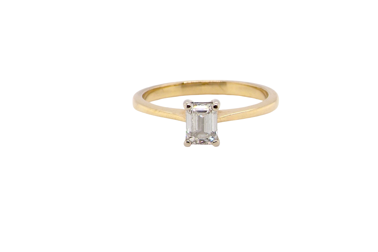 Elegant and timeless, this solitaire ring features a beautifully cut emerald-cut diamond measuring 5 x 4mm, confirmed at approximately 0.40 carats. The diamond is graded J colour and VS clarity, offering excellent sparkle and impressive clarity for everyday wear or a meaningful occasion piece.