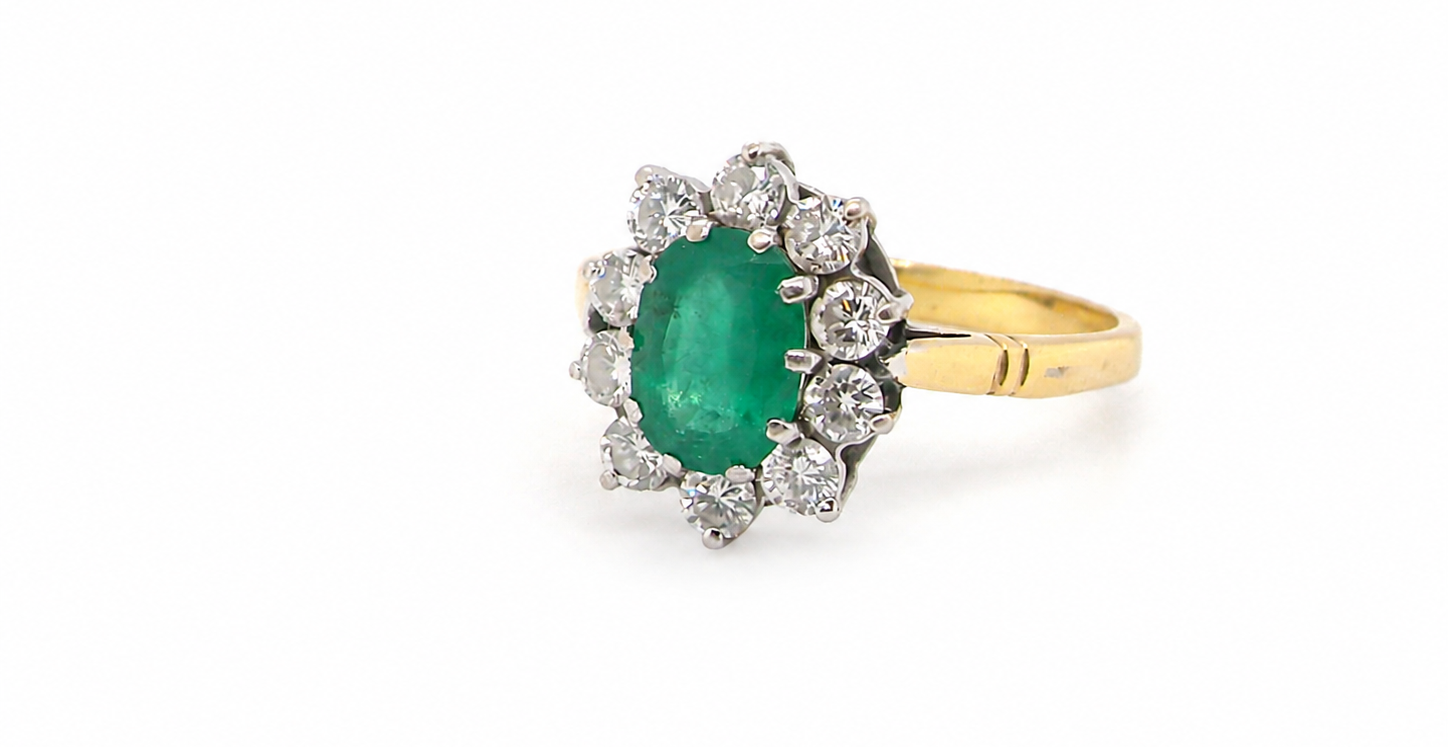 Features an oval cut emerald centre stone, vibrant green hues, measures 9x6mm(est 1.75 carats) . Complimented by an outer halo of ten 2.7mm brilliant cut white diamonds (