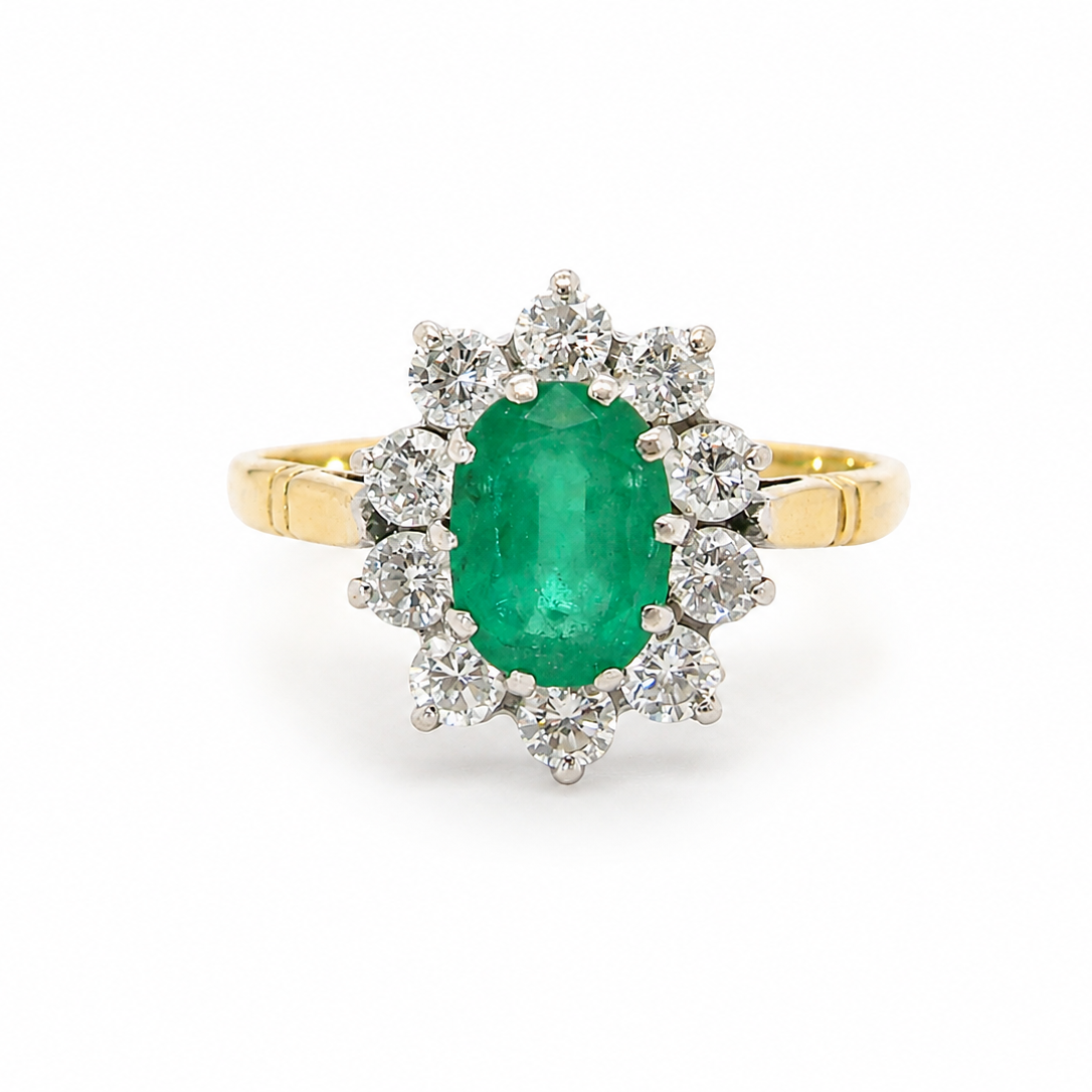 Features an oval cut emerald centre stone, vibrant green hues, measures 9x6mm(est 1.75 carats) . Complimented by an outer halo of ten 2.7mm brilliant cut white diamonds (est total 0.60 carats)