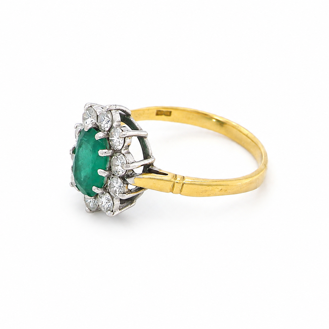 Features an oval cut emerald centre stone, vibrant green hues, measures 9x6mm(est 1.75 carats) . Complimented by an outer halo of ten 2.7mm brilliant cut white diamonds (est total 0.60 carats) colour i-j, clarity S.
side