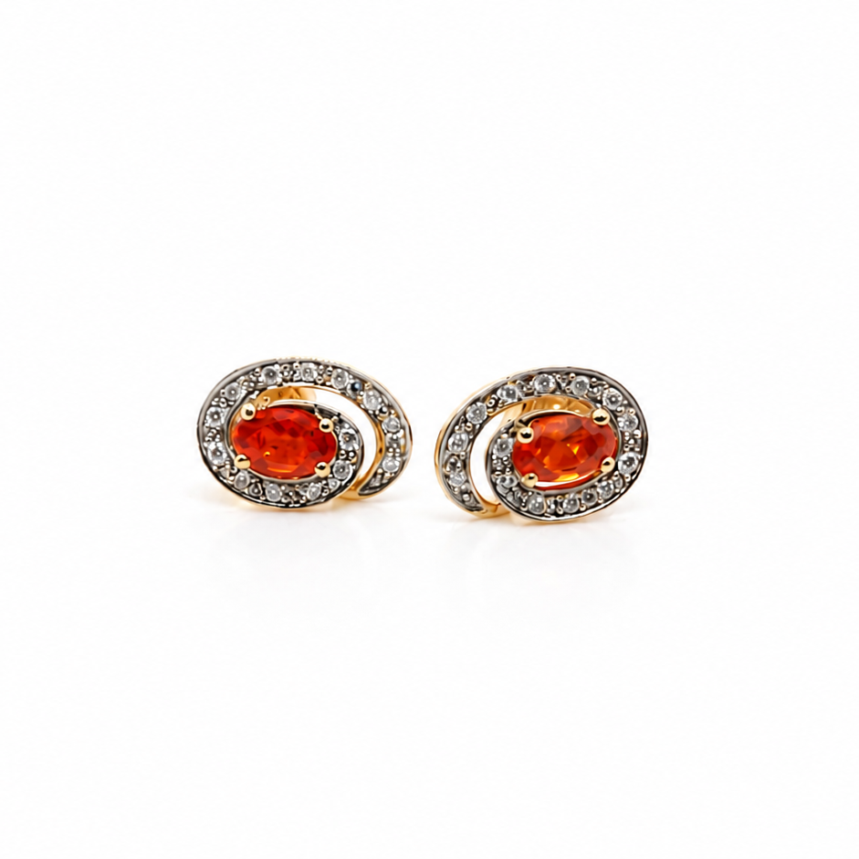 Pair of earrings with fire opals on a white background