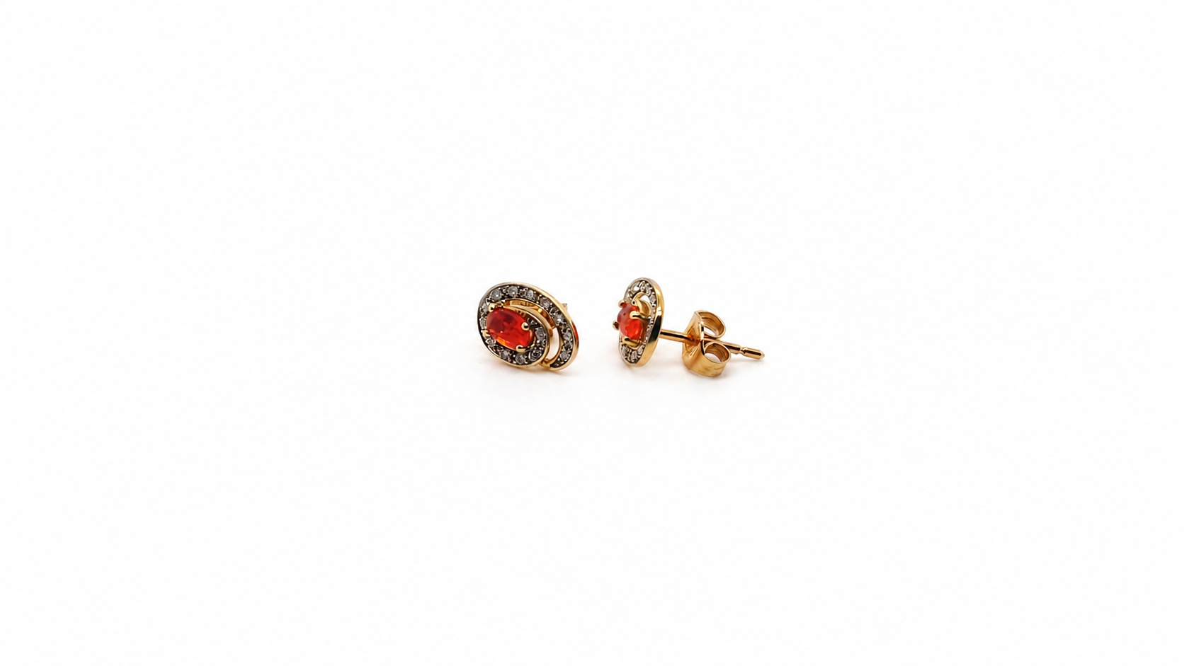 Pair of earrings with fire opals on a white background side view