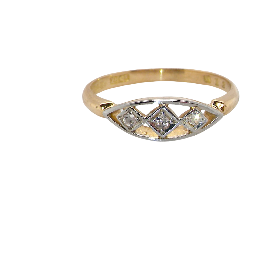 Gold ring with diamond accents on a white background