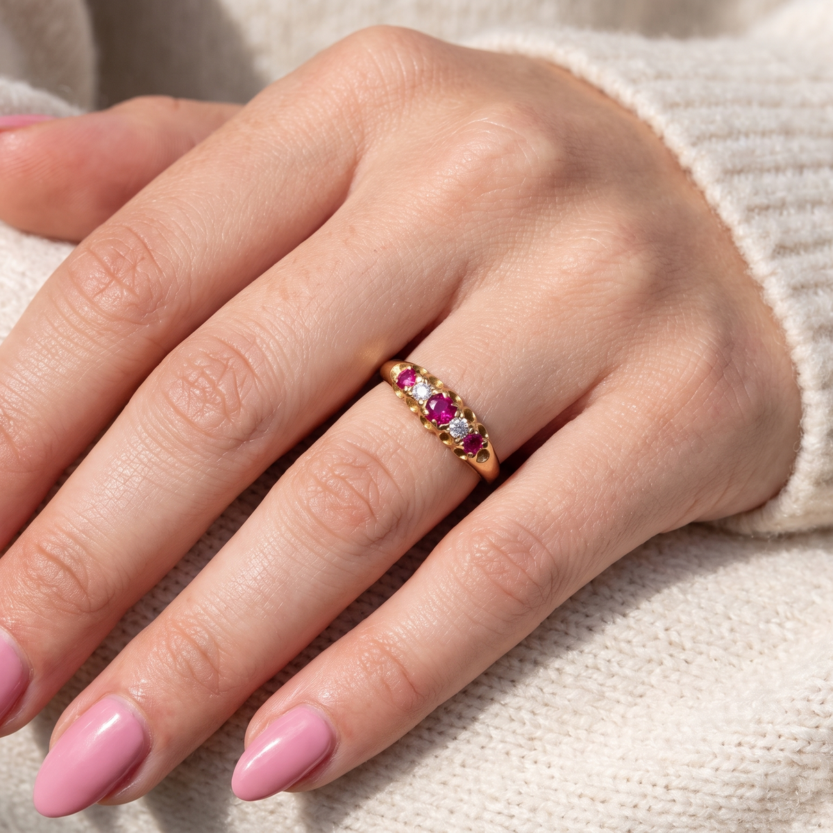 HAND A vintage 18 carat gold three stone ring. Set with brilliant cut white diamonds, cente 3mm, each side a 2.4mm diamond (total est 0.20 carats) Colour I-j, clarity Si. 
