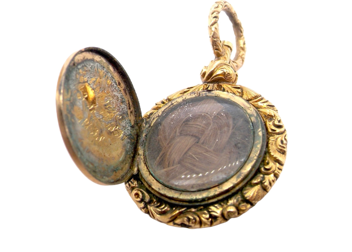 A gold memorial locket