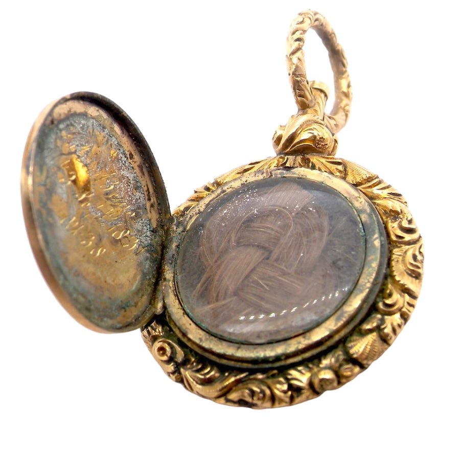 A gold memorial locket