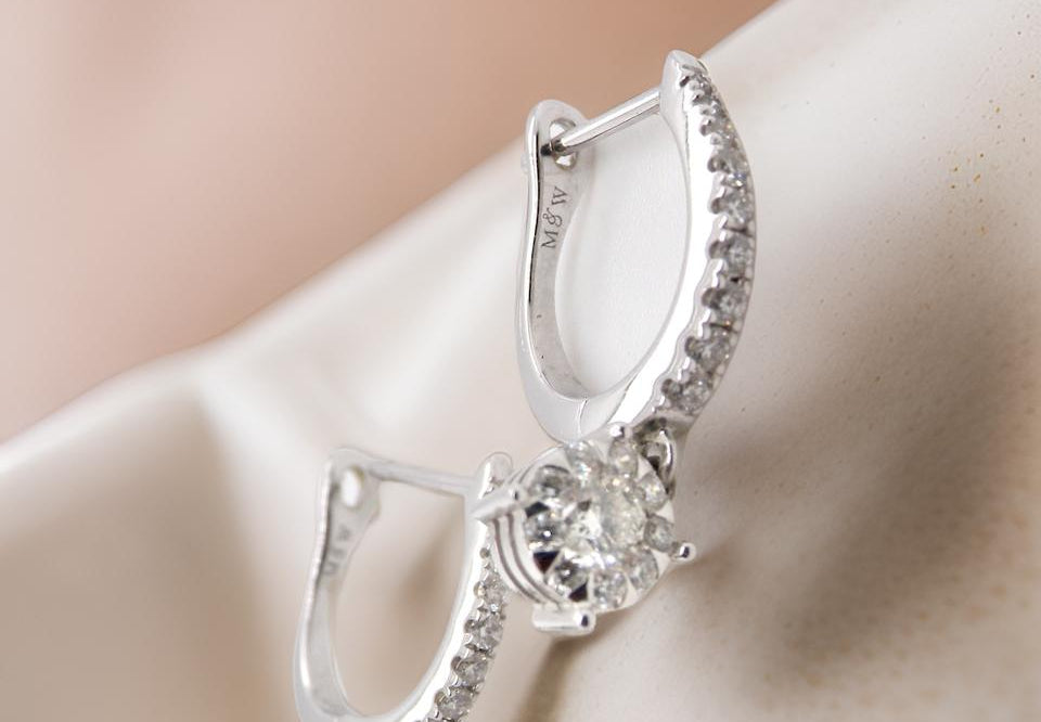 A pair of diamond hoop and drop earrings