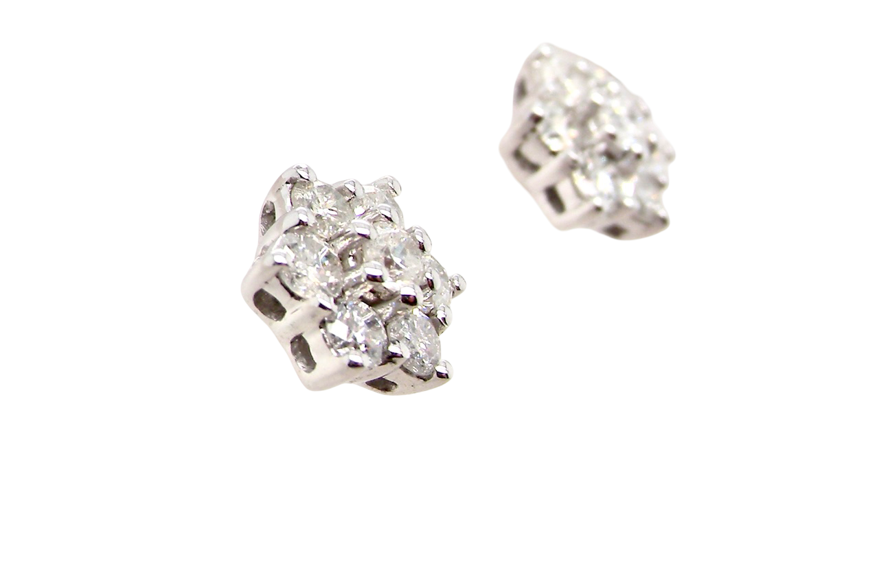 single A fine pair of 9 carat white gold diamond stud earrings. 
