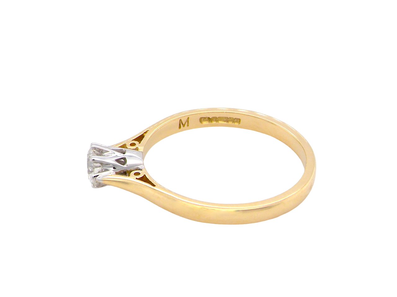 Two-tone gold ring with a diamond on a white background
