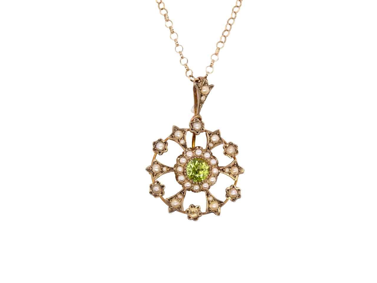This exquisite piece features a 6mm peridot at its centre, framed by a delicate border of fine seed pearls.