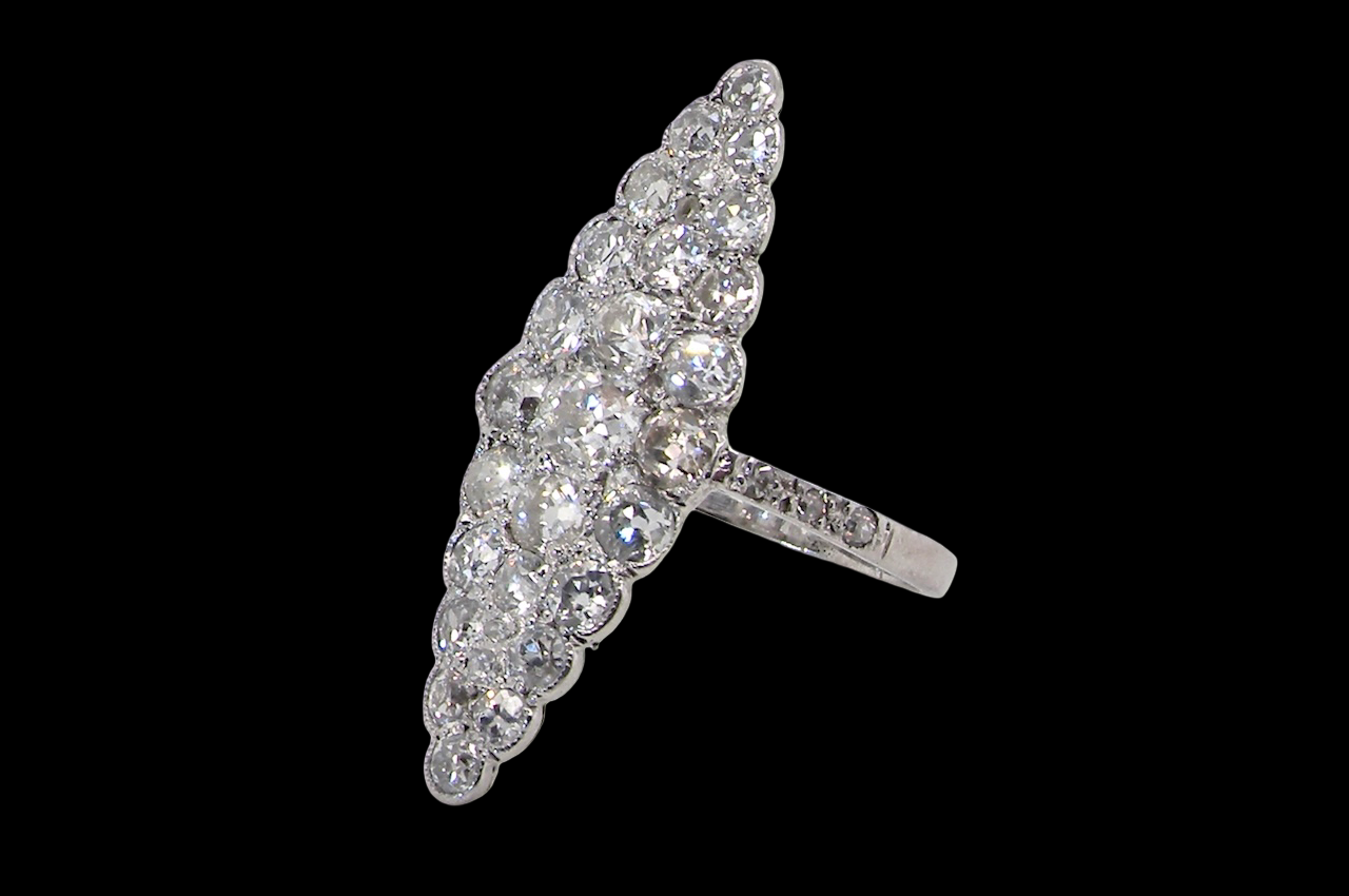 This is a striking marquise-shaped diamond cluster ring a very classic, vintage-inspired look.