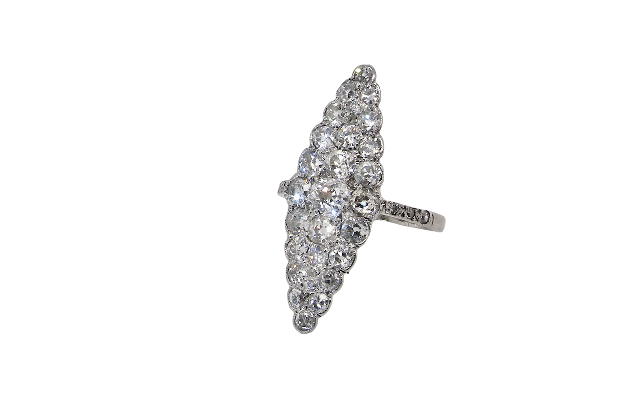 This is a striking marquise-shaped diamond cluster ring with a classic, vintage-inspired look.