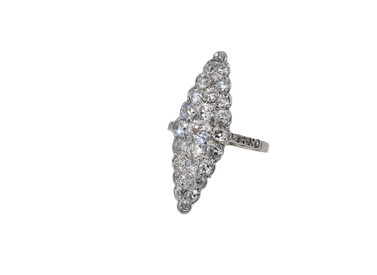 This is a striking marquise-shaped diamond cluster ring with a classic, vintage-inspired look.