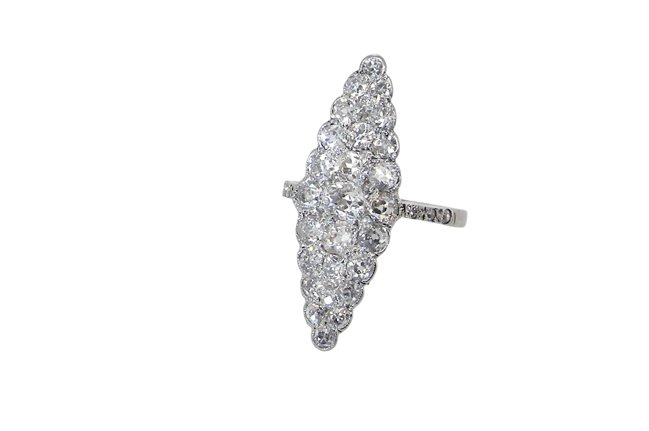 This is a striking marquise-shaped diamond cluster ring with a very classic, vintage-inspired look.