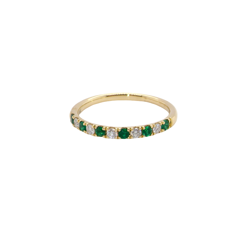 This ring is set with six bright green emeralds, each 2mm, (est 0.25 carats) and five 2mm brilliant cut white diamonds.