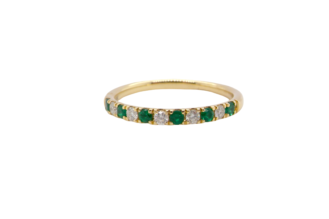 This ring is set with six bright green emeralds, each 2mm,and five 2mm brilliant cut white diamonds.