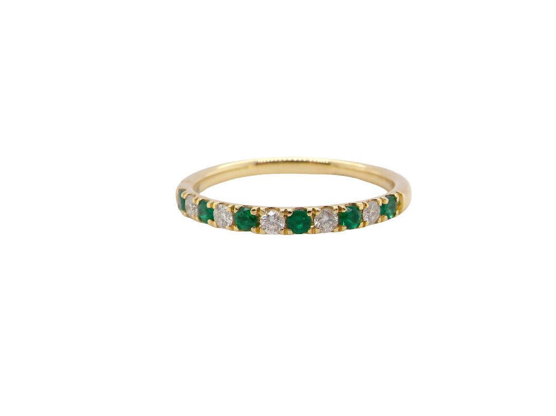 This ring is set with six bright green emeralds, each 2mm,and five 2mm brilliant cut white diamonds.