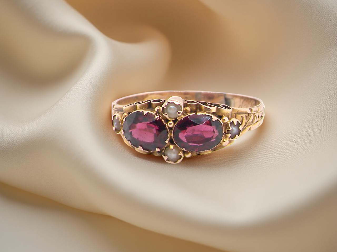 Victorian dress ring, beautifully set with matching oval-cut garnets