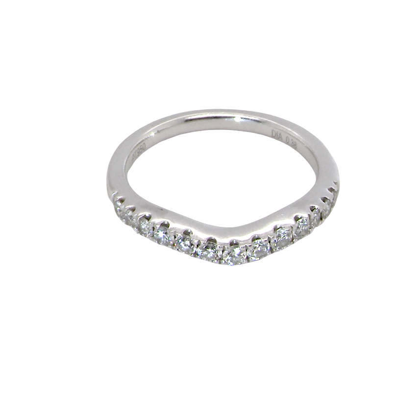 above A Platinum half hoop ring featuring a gently contoured U-shaped centre, designed to allow a cluster or solitaire ring to sit comfortably alongside.