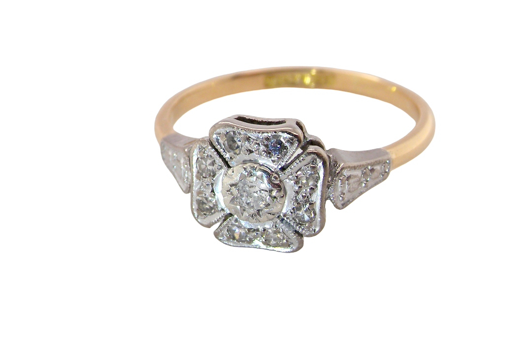 above A vintage diamond cluster ring. Shaped like a four leaf clover, each leaf is pavé set with small white diamonds, two each x 1.5mm. Centre diamond 2.4mm. (total estimated total 0.17 carats)