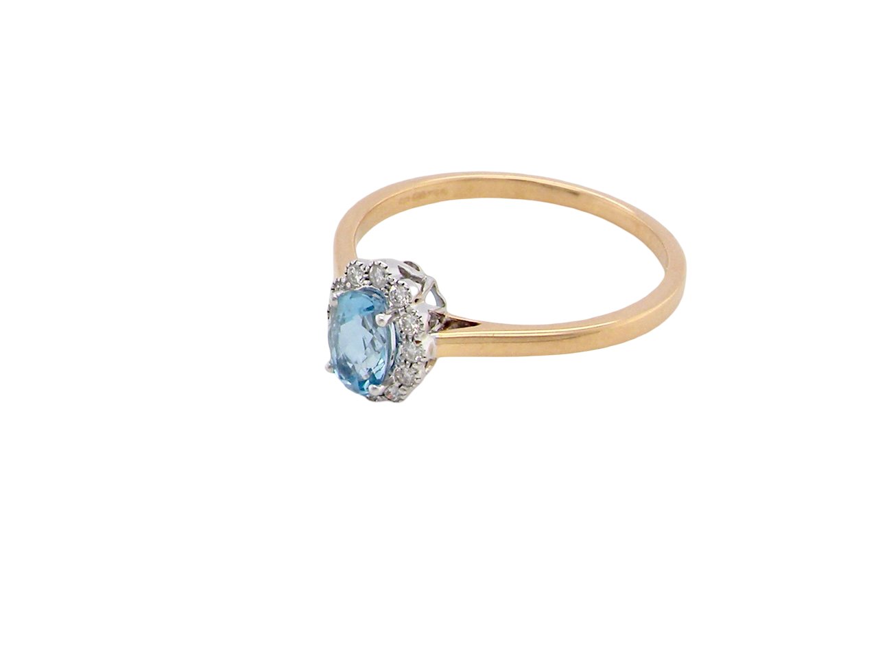 above An 18 carat gold cluster ring. Set to the centre a lovely ice blue aquamarine 6x4mm, claw set.