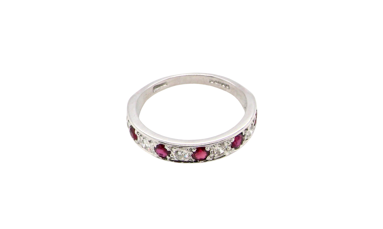 above view An 18 carat white gold half hoop eternity ring. Set with five round 3mm rubies (est 0.50 carats) 