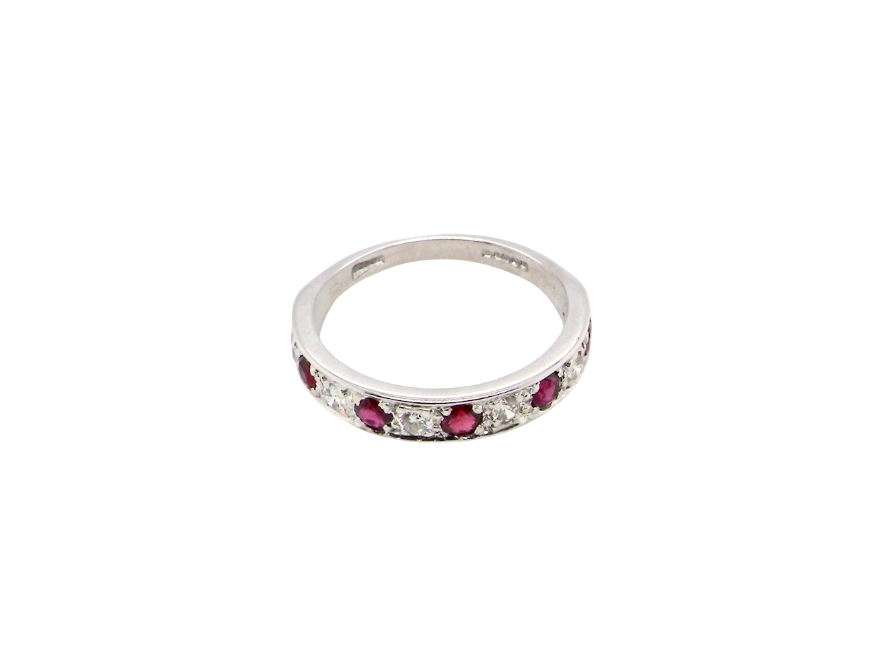 above view An 18 carat white gold half hoop eternity ring. Set with five round 3mm rubies (est 0.50 carats) 