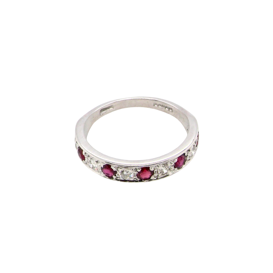 above view An 18 carat white gold half hoop eternity ring. Set with five round 3mm rubies (est 0.50 carats) 
