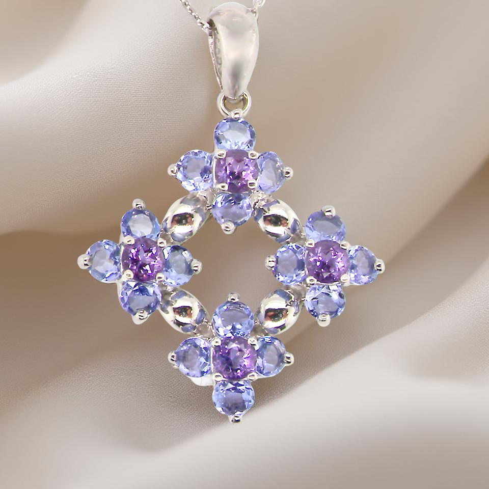 A white gold amethyst and tanzanite pendant