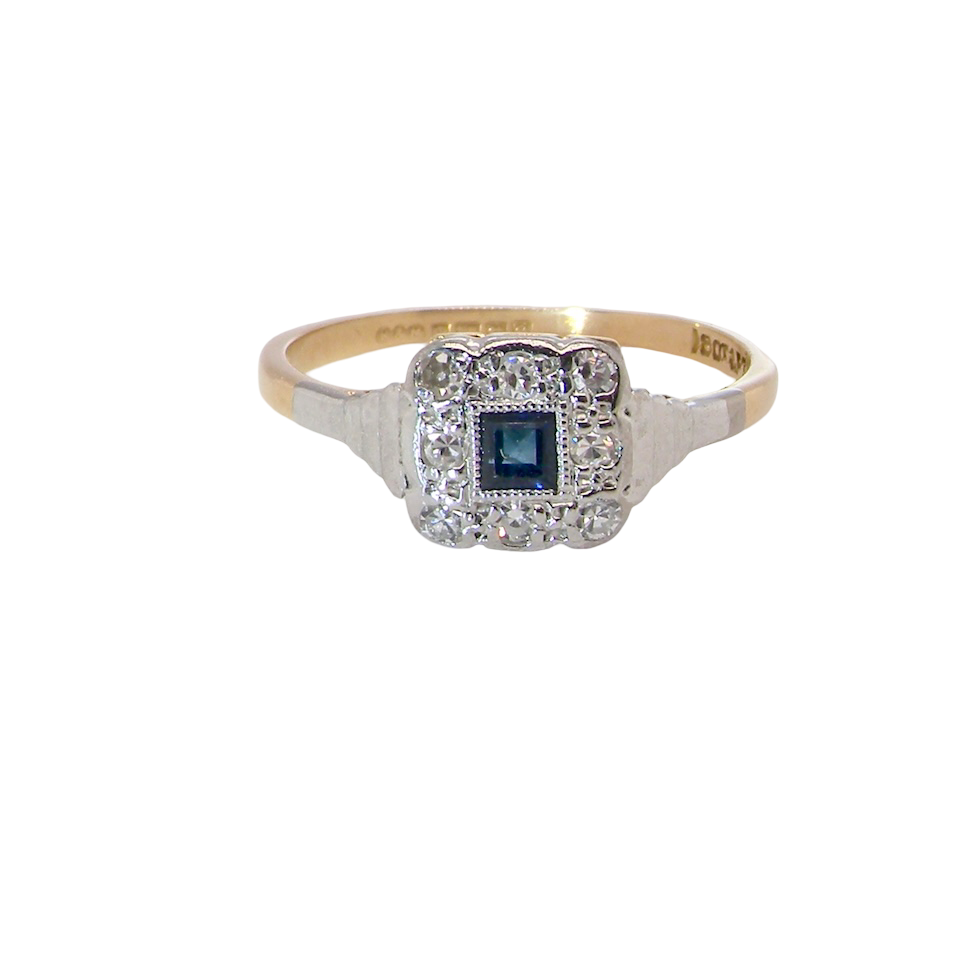 antique cluster ring. Features a small square sapphire