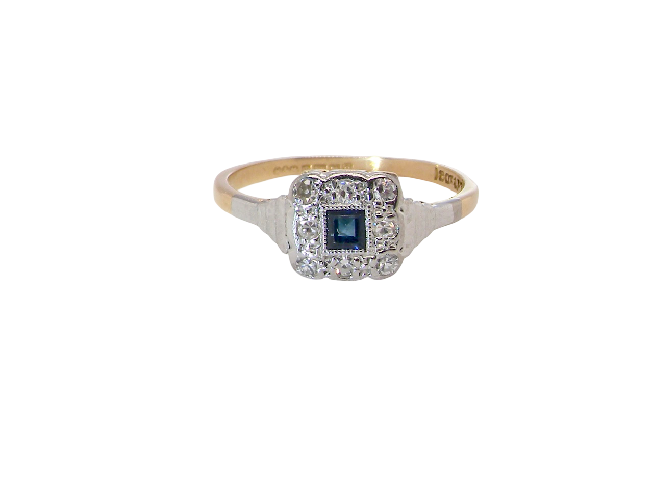 antique cluster ring. Features a small square sapphire