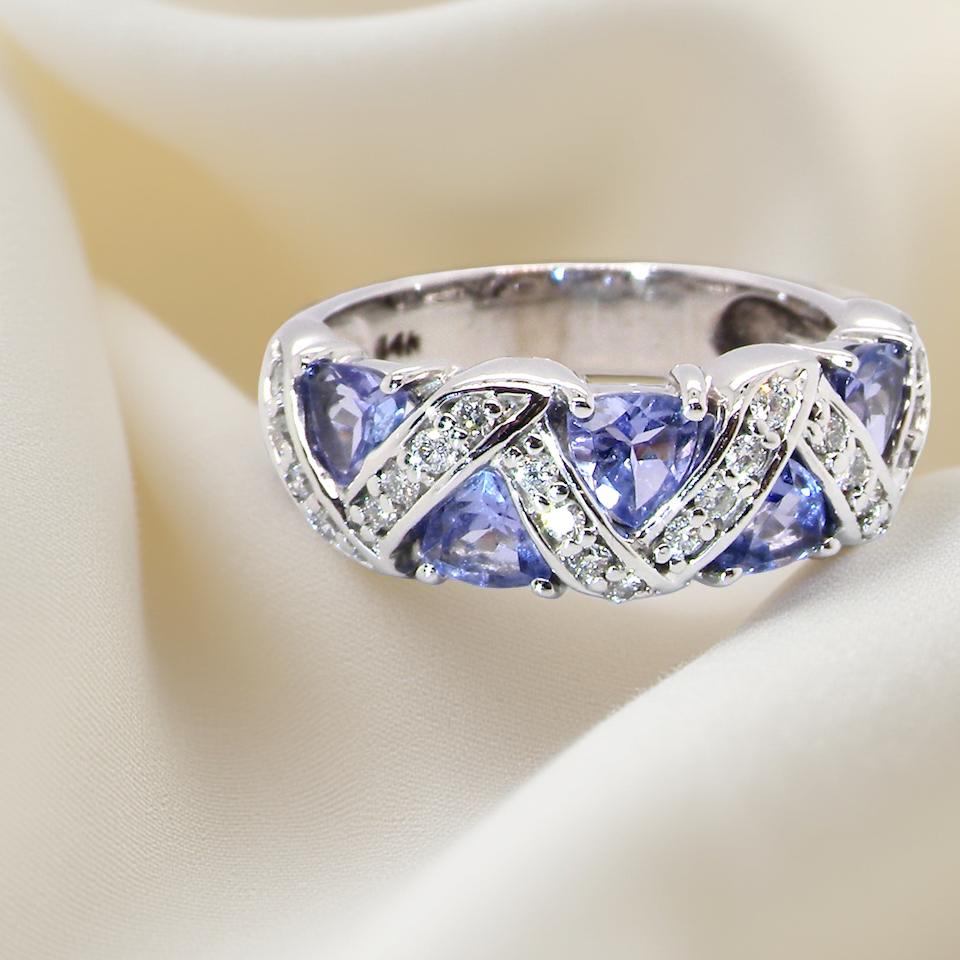 beautiful and eye-catching dress ring set in 14ct white gold, featuring triangular tanzanite gemstones